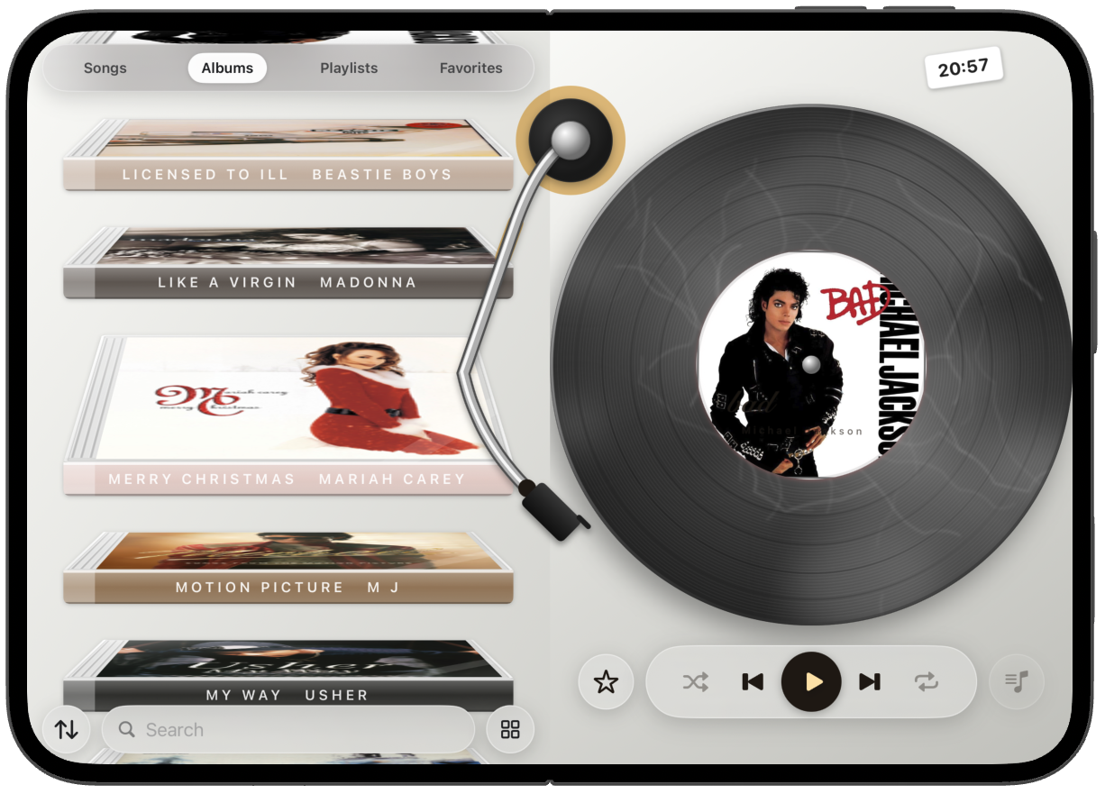 iPhone Duo open flat, albums beside a vinyl record.
