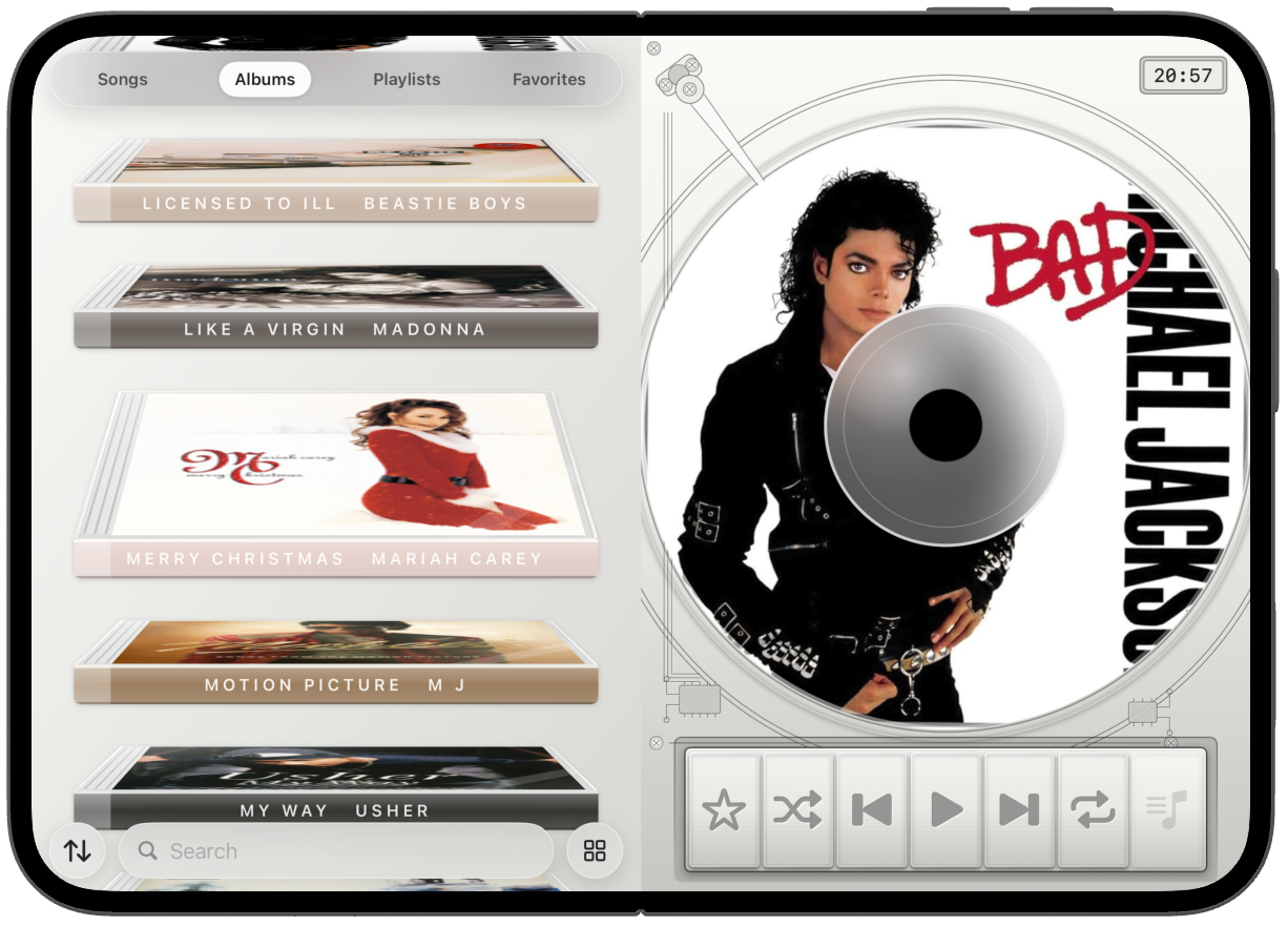 iPhone Duo open flat, albums beside the disc.