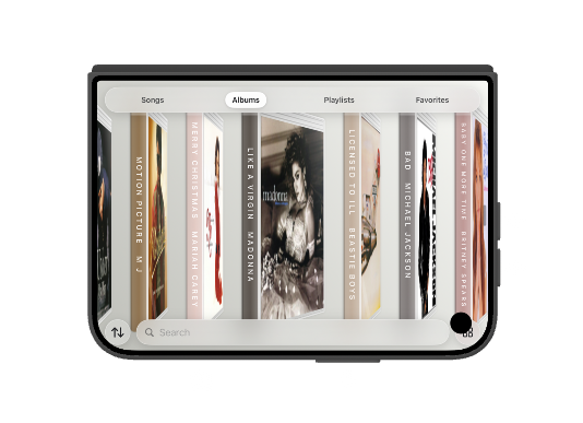 iPhone Duo stood in a tent, album spines facing forward.